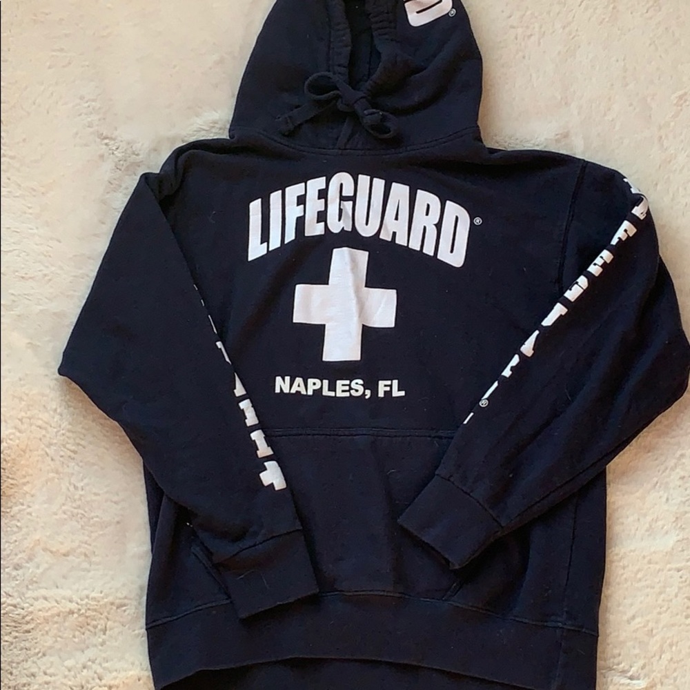 A navy blue lifeguard hoodie from Naples, Florida